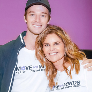 patrick schwarzenegger and maria shriver embracing for a photo