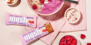 MOSH raspberry white chocolate protein bar in a wrapper featuring brain boosting ingredients